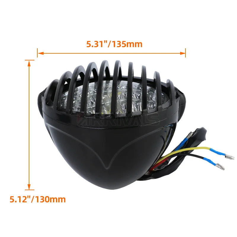 Grille de protection métallique noire posée sur un phare rond de moto rétro - vue 5